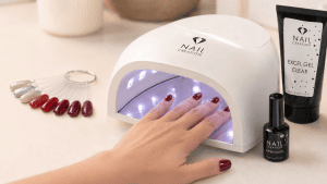 Hand curing gel nails correctly under a professional Nail Creation UV LED lamp