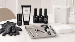 Clean professional nail workstation with Nail Creation products, gloves, wipes and disinfected tools